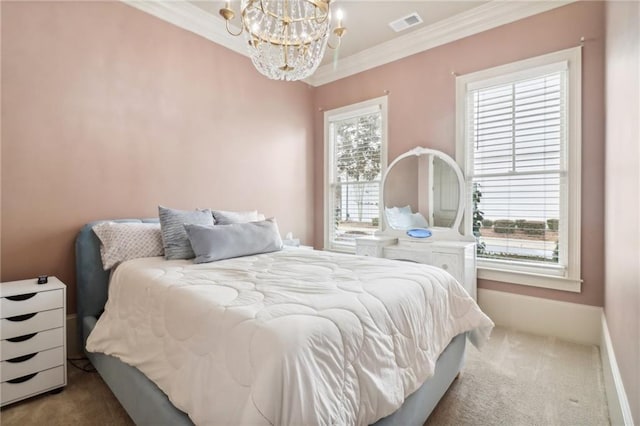 carpeted bedroom featuring crown molding and a notable chandelier