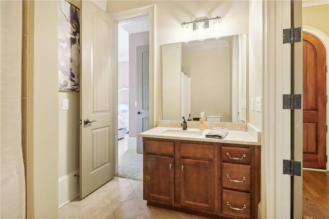 bathroom with tile patterned flooring and vanity