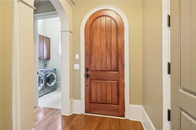 interior space with light hardwood / wood-style floors and washer and dryer