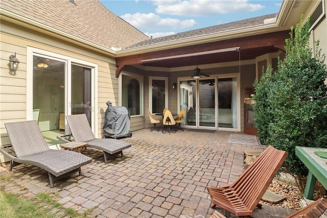 view of patio featuring ceiling fan