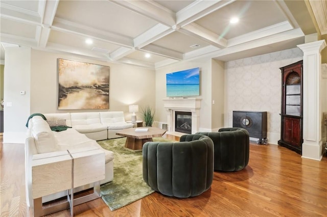 living room with beamed ceiling, wood-type flooring, and coffered ceiling