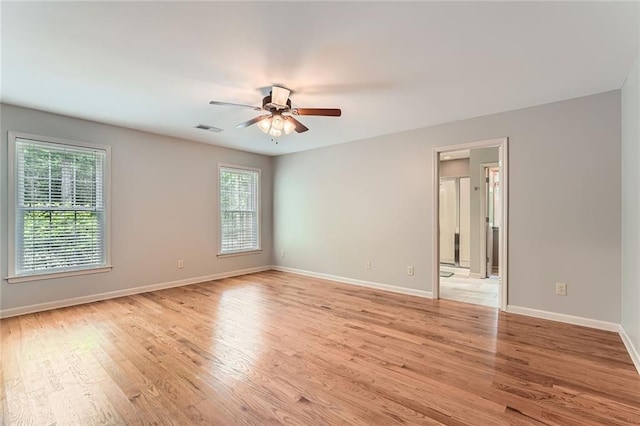 245 Sutallee Ridge Ln NE, White, GA 30184 - spare room with healthy amount of natural light, light wood-style flooring, baseboards, and ceiling fan