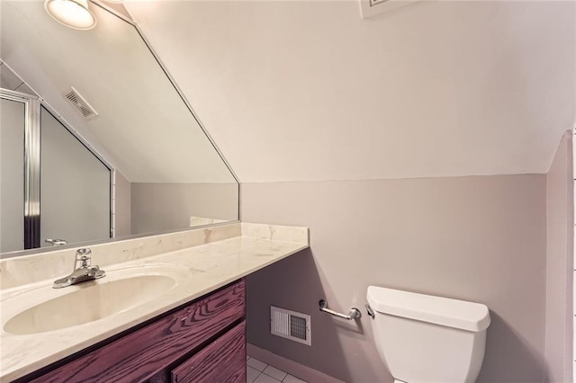 245 Sutallee Ridge Ln NE, White, GA 30184 - bathroom with lofted ceiling, toilet, vanity, a shower with door, and tile patterned floors