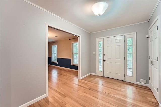 245 Sutallee Ridge Ln NE, White, GA 30184 - entrance foyer featuring crown molding, light wood-style flooring, healthy amount of natural light, and baseboards
