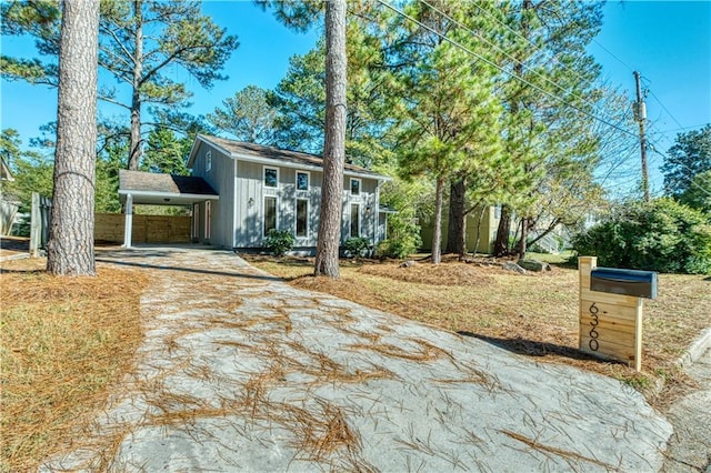 view of front of property featuring a carport