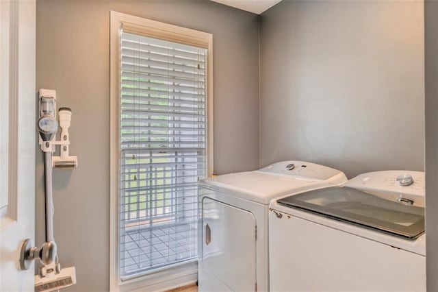 laundry room featuring independent washer and dryer and laundry area