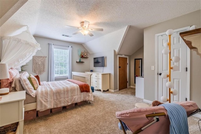 bedroom featuring a ceiling fan, a textured ceiling, visible vents, vaulted ceiling, and light carpet