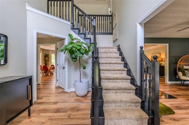 stairs with wood finished floors
