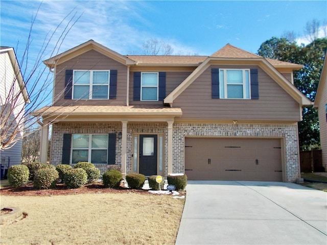 view of front of property with a garage