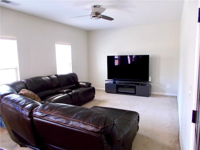 carpeted living room featuring a healthy amount of sunlight and ceiling fan