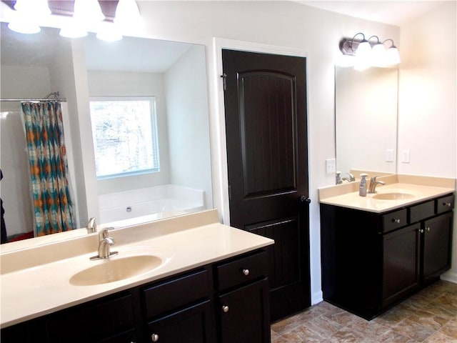 bathroom featuring vanity and separate shower and tub