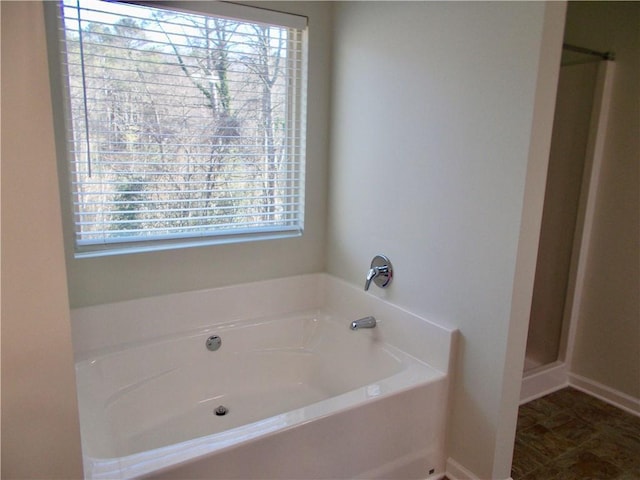 bathroom featuring a tub