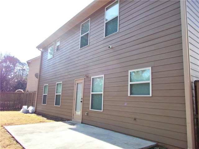 back of property featuring a patio