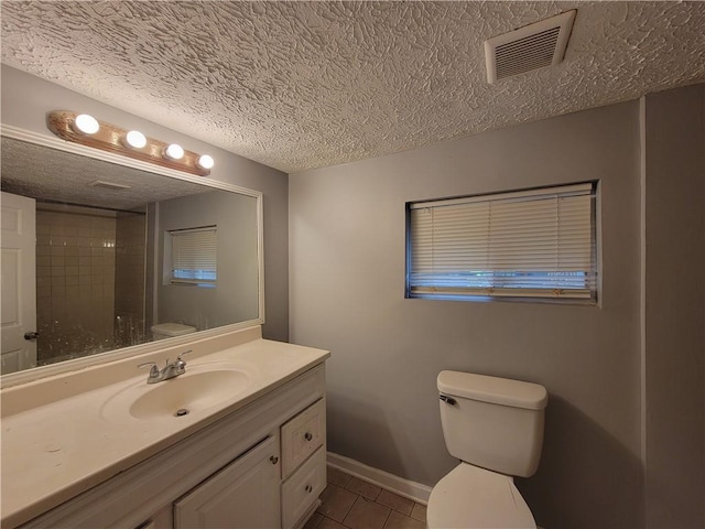 2940 Grand Ave SW, Atlanta, GA 30315 - bathroom with a textured ceiling, tile patterned flooring, visible vents, toilet, and baseboards