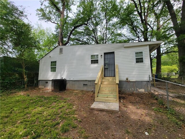 2940 Grand Ave SW, Atlanta, GA 30315 - rear view of house with central air condition unit, crawl space, and fence