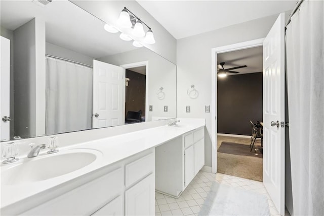 bathroom featuring ceiling fan, tile patterned flooring, and vanity