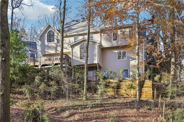 back of property featuring a wooden deck