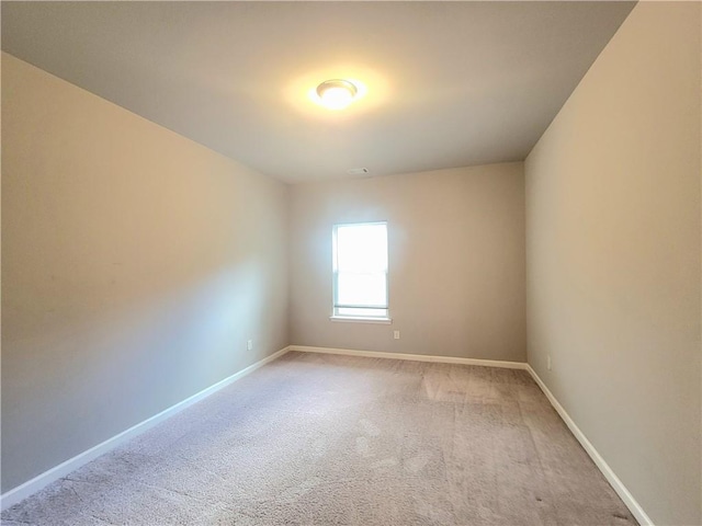 empty room featuring light carpet