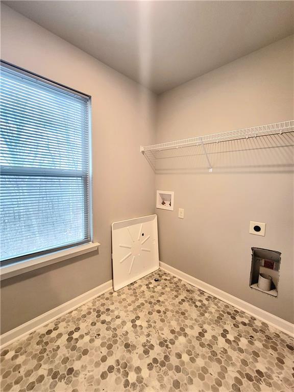 laundry room with electric dryer hookup and hookup for a washing machine