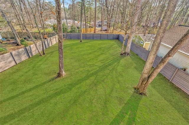 view of yard with a fenced backyard