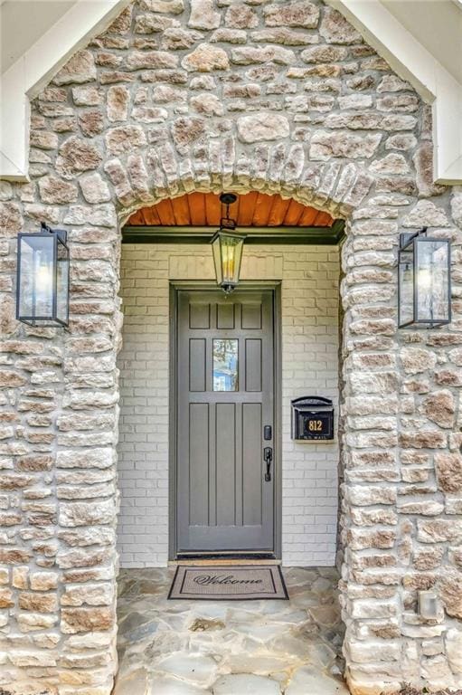 entrance to property with brick siding