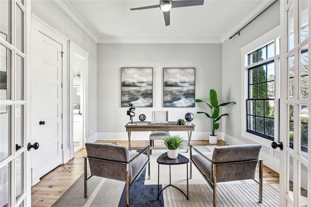 office area with baseboards, ornamental molding, wood finished floors, and french doors