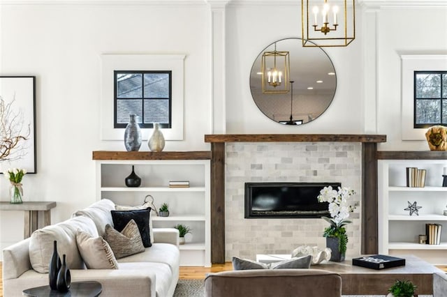 living area featuring built in shelves and wood finished floors