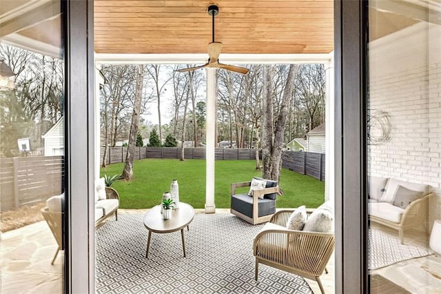 exterior space with brick wall, plenty of natural light, and a sunroom