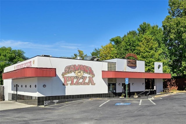 view of property with uncovered parking