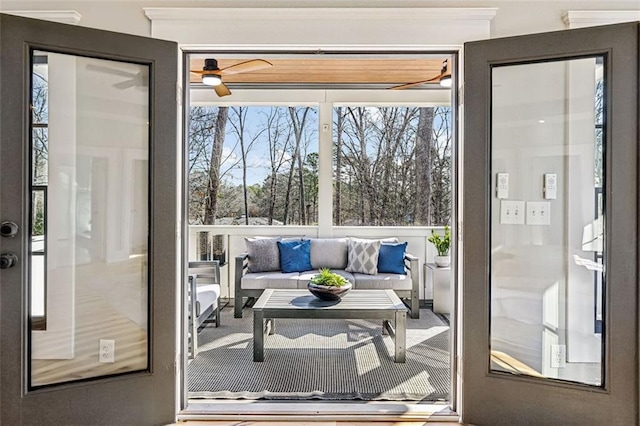 doorway with a ceiling fan