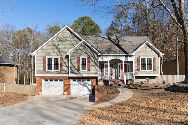 bi-level home with a porch and a garage