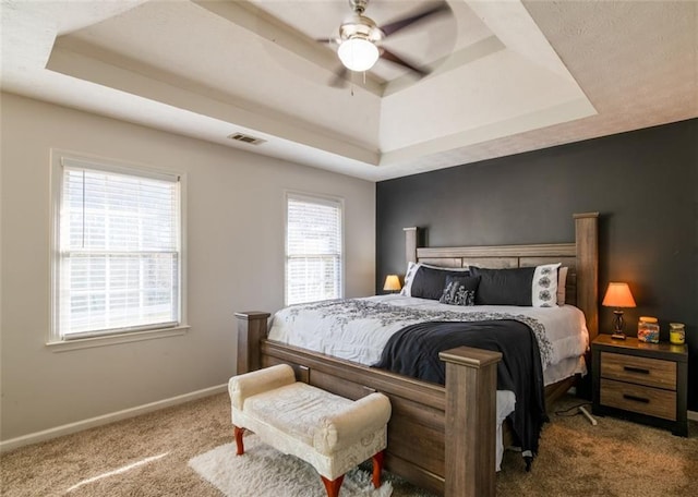 161 Honey Creek Rd, Mcdonough, GA 30252 - carpeted bedroom with a tray ceiling, baseboards, and ceiling fan