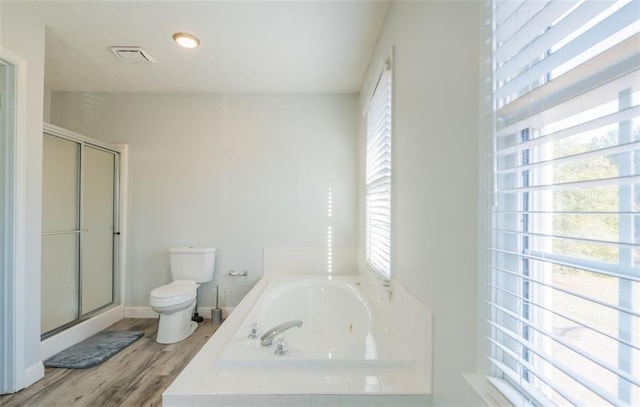 161 Honey Creek Rd, Mcdonough, GA 30252 - bathroom featuring toilet, a whirlpool tub, a shower stall, wood finished floors, and baseboards