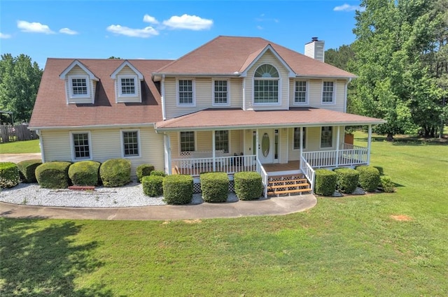 161 Honey Creek Rd, Mcdonough, GA 30252 - view of front of house featuring covered porch, a front lawn, and a chimney