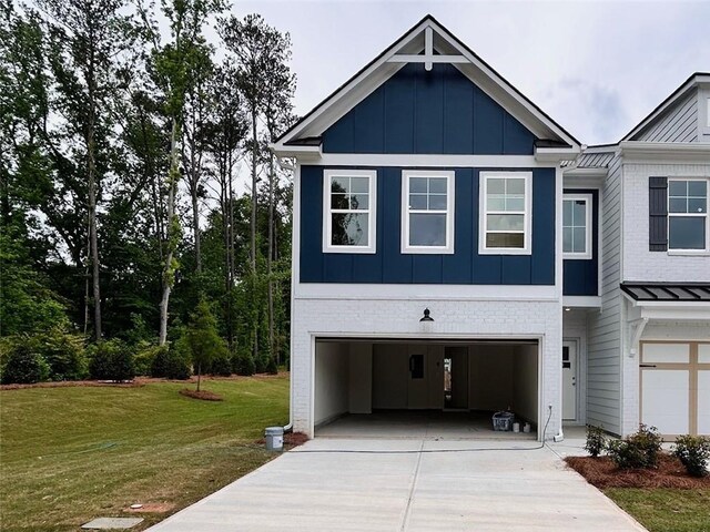 view of front facade with board and batten siding, an attached garage, concrete driveway, and a front lawn