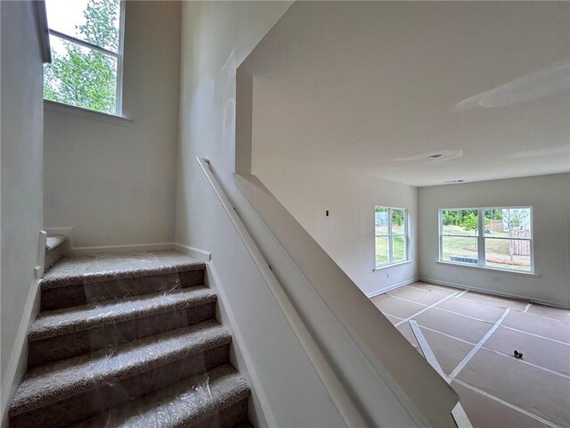 stairway featuring baseboards