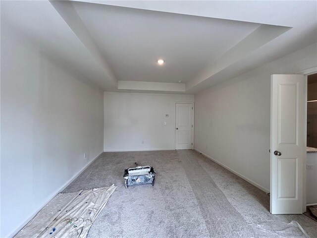 interior space with baseboards and carpet