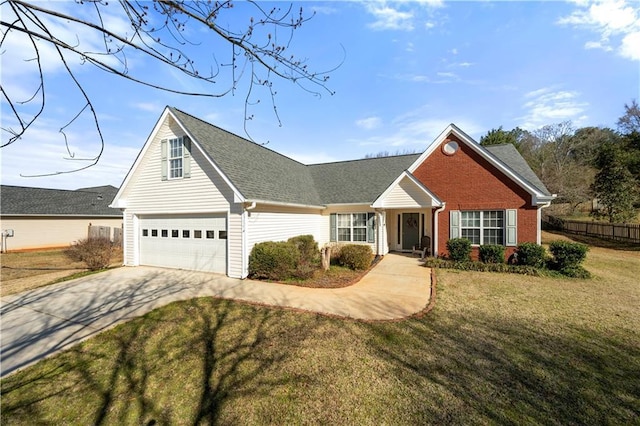 traditional-style house featuring brick siding, concrete driveway, and a front yard