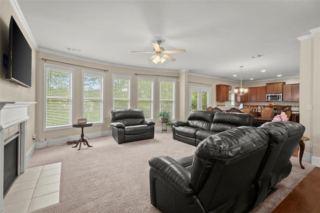 1709 Grove Ct SE, Conyers, GA 30013 - living room with ornamental molding, a fireplace, a ceiling fan, baseboards, and recessed lighting
