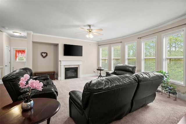 1709 Grove Ct SE, Conyers, GA 30013 - living area featuring crown molding, carpet floors, ceiling fan, baseboards, and a glass covered fireplace
