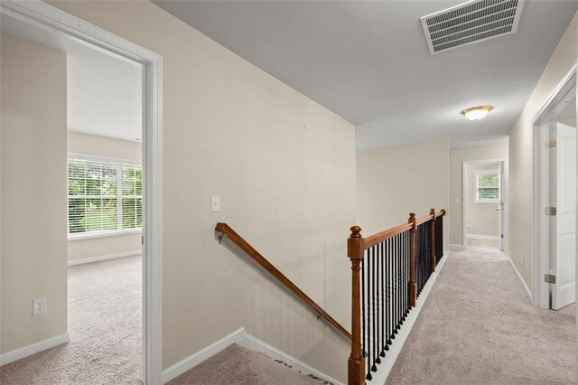 1709 Grove Ct SE, Conyers, GA 30013 - corridor featuring an upstairs landing, carpet floors, and baseboards