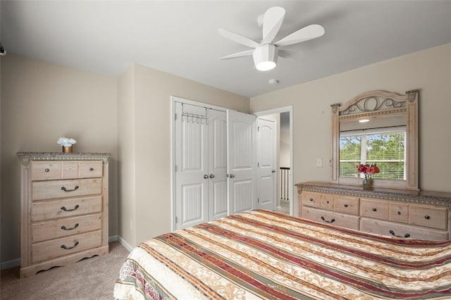 1709 Grove Ct SE, Conyers, GA 30013 - bedroom featuring light colored carpet, a closet, a ceiling fan, and baseboards