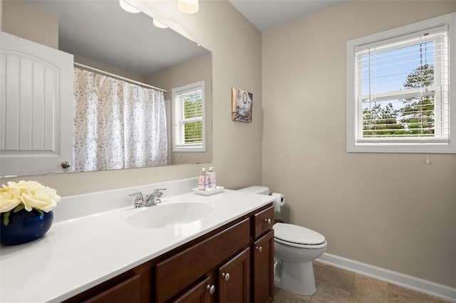 1709 Grove Ct SE, Conyers, GA 30013 - full bathroom with vanity, toilet, and baseboards
