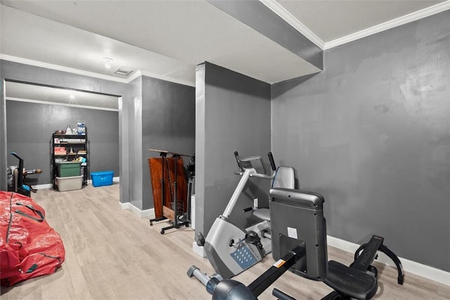 1709 Grove Ct SE, Conyers, GA 30013 - workout room featuring wood finished floors, crown molding, and baseboards
