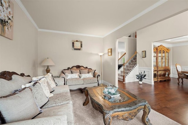 1709 Grove Ct SE, Conyers, GA 30013 - living area with wood finished floors, ornamental molding, stairway, and wainscoting
