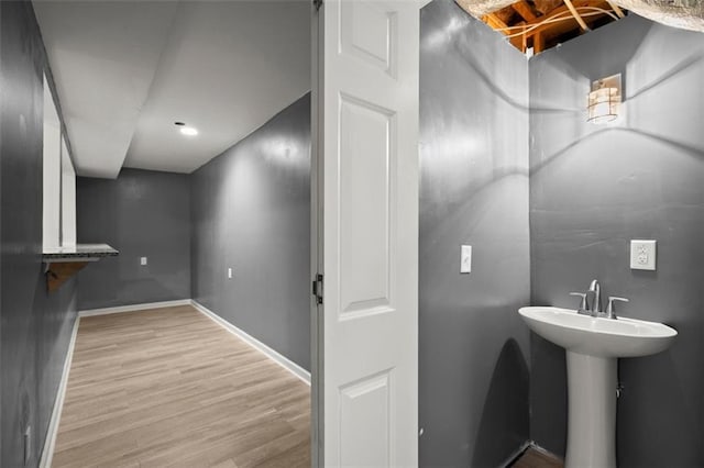 1709 Grove Ct SE, Conyers, GA 30013 - bathroom featuring wood finished floors and baseboards