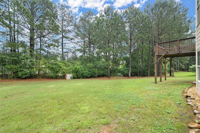 1709 Grove Ct SE, Conyers, GA 30013 - view of grassy yard with a wooden deck