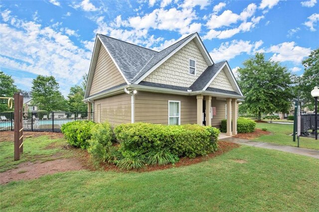 1709 Grove Ct SE, Conyers, GA 30013 - view of side of home with a shingled roof