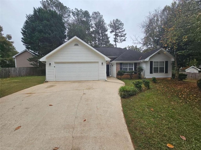 ranch-style home featuring a garage and a front yard