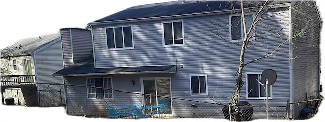 view of front facade featuring fence